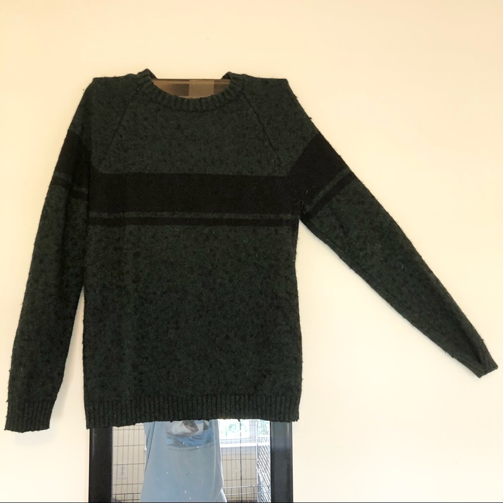 Dark green striped sweater.